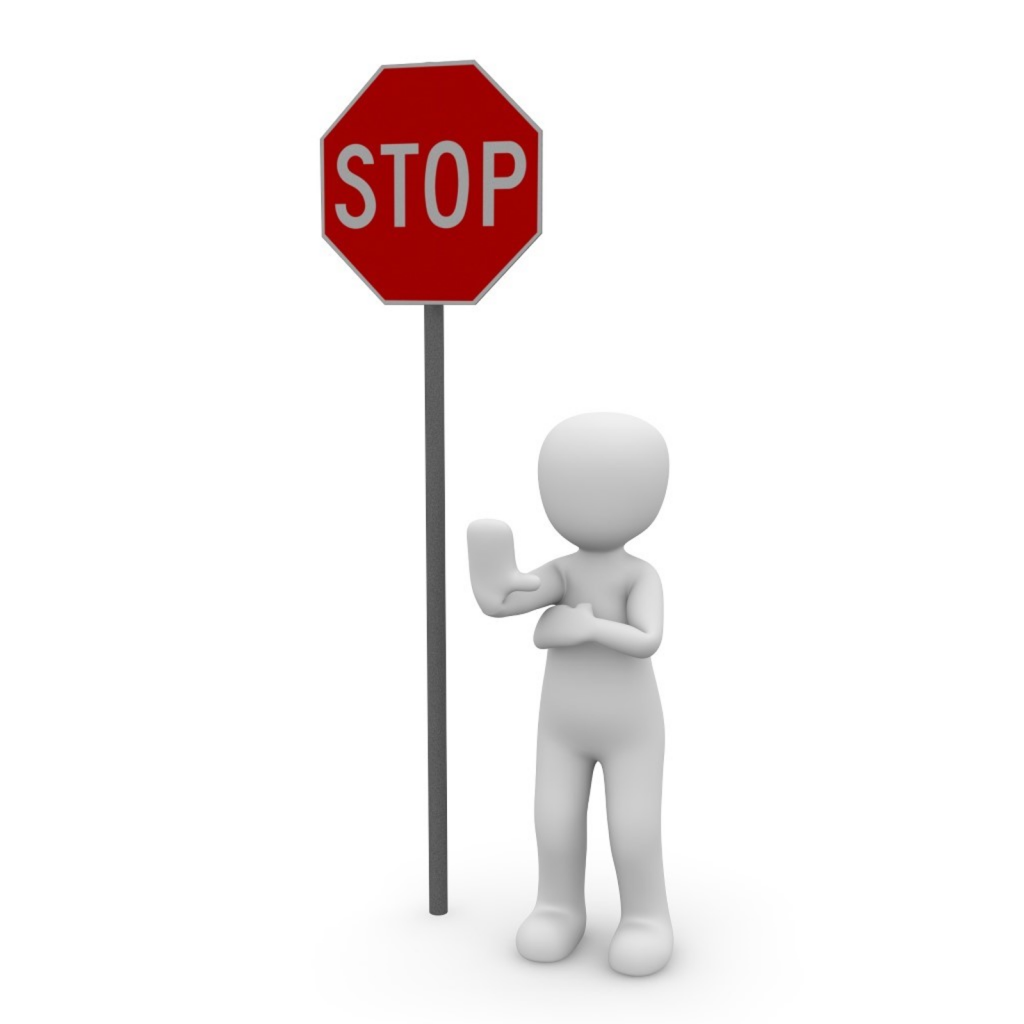 a cartoon of a human standing near a stop sign post